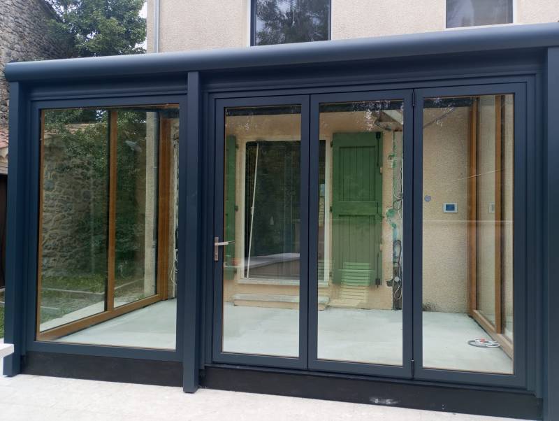 Installation d'une véranda vitrée en alu et bois sur mesure proche de Sederon dans la Drôme (26)